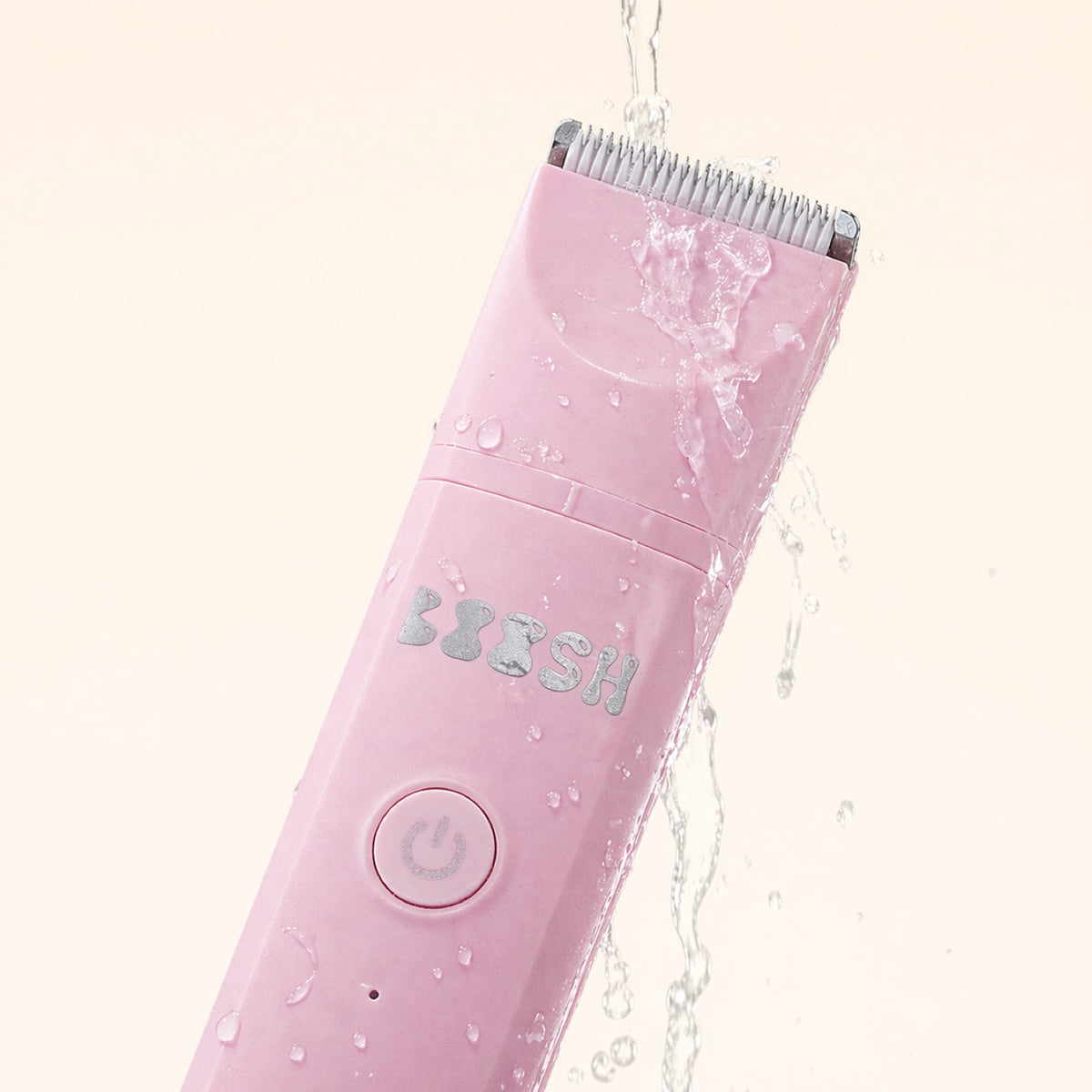 Boosh trimmer with water running over it